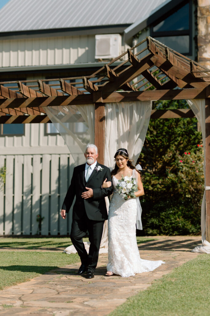 bride and father walking down aisle at Blue Mountain Vineyards Wedding